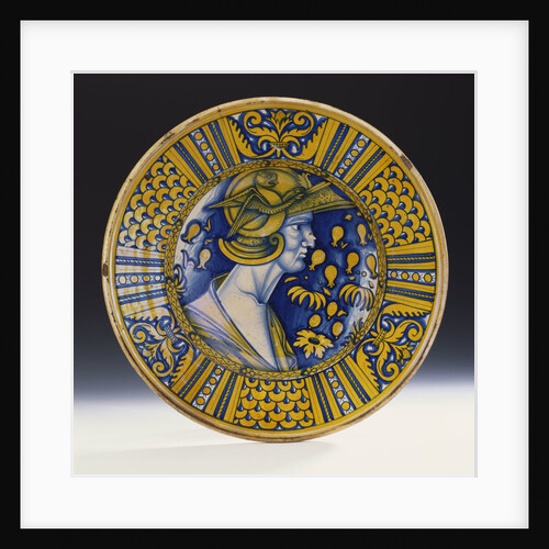 A Deruta lustred portrait dish painted in blue and lustred in yellow depicting a warrior in a helmet with a winged griffin by Anonymous