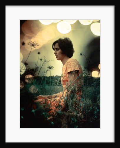 1970s Serious Woman In Field Flowers With Soft Focus Special Effect by Anonymous