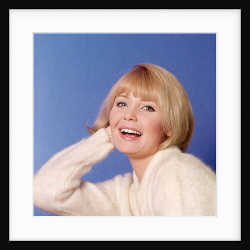 1970s Portrait Of Woman With Blond Hair And White Sweater by Anonymous