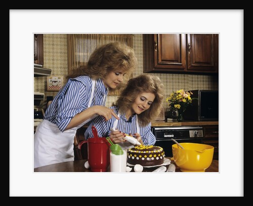 1970s Mother Daughter Dressed Alike Decorating Cake by Anonymous