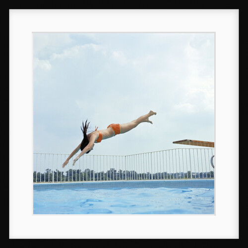 1970s Teen Girl Diving Into Swimming Pool by Anonymous