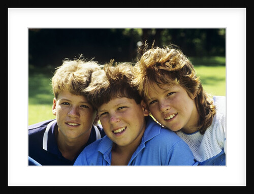 1980s Two Brothers And Their Sister Posed Heads Together Smiling Looking At Camera by Anonymous