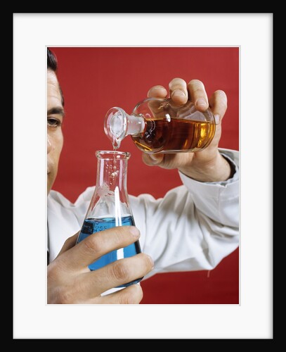 1970s Lab Worker Man Pouring Liquid From Bottle Into Flask by Anonymous