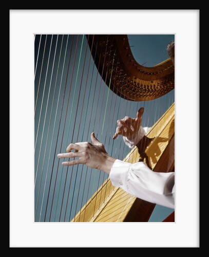 1960 1960s Retro Close Up Of Womans Hands Playing Harp Plucking Strings by Anonymous
