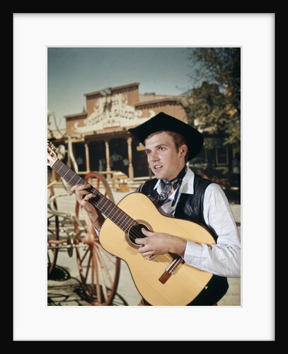 1960s Man Singing Cowboy Strumming Playing Acoustic Guitar by Anonymous