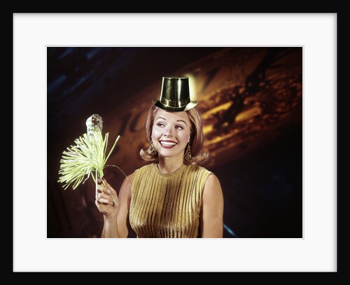 1960s Young Blonde Woman Party Hat Noisemaker Horn Smiling New Year Clock Background by Anonymous