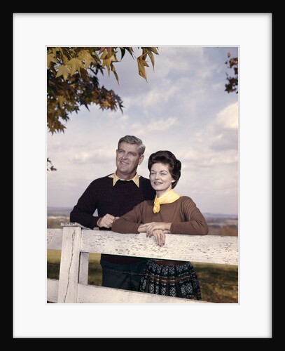 portrait Couple Husband & Wife Smiling Standing Together Behind White Board Fence Outdoor by Anonymous
