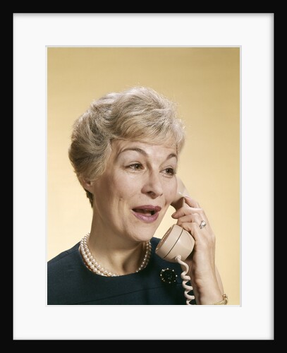 1960s Smiling Happy Senior Woman Talking On Telephone by Anonymous