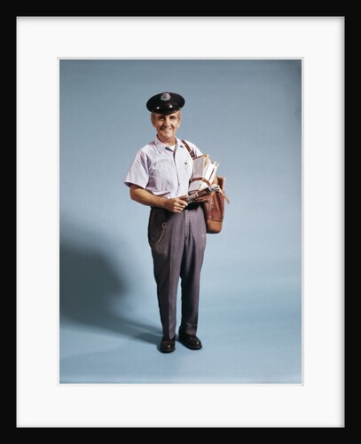 1970s Standing Full Length Portrait Of Middle Aged Mailman Carrying Mail Bag Wearing Uniform by Anonymous