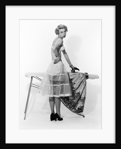 1950s Woman Wearing Underwear Ironing Dress At Ironing Board by Anonymous