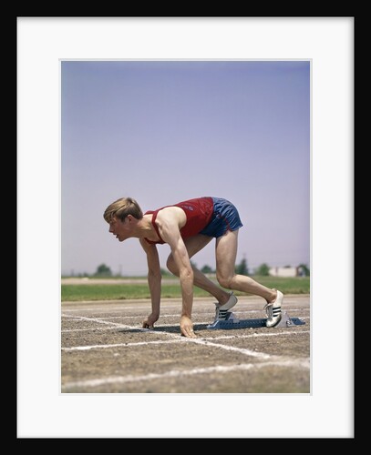 1960s 1970s Profile Athlete Runner In Starting Block At Beginning Of Race by Anonymous