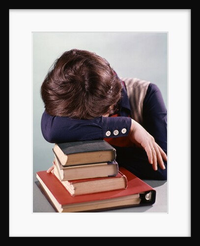 1960s 1970s Female Student Head Down On Pile Of Books Asleep Exhausted by Anonymous