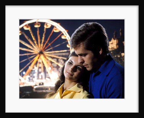 1960 1960s 1970 1970s Couple Man Woman Romantic Head To Head Lights Of Ferris Wheel Amusement Park Background by Anonymous