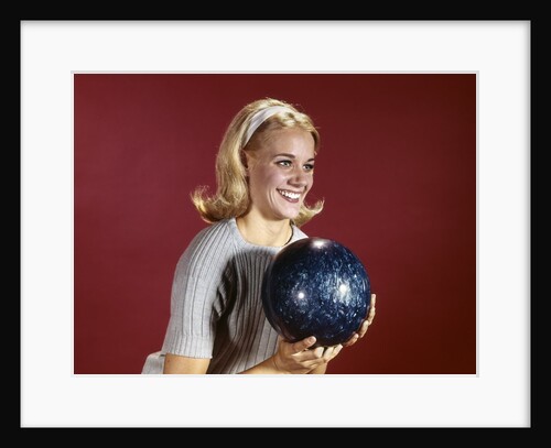 1960s Young Blonde Woman Holding Bowling Ball Wearing Blue Sweater by Anonymous