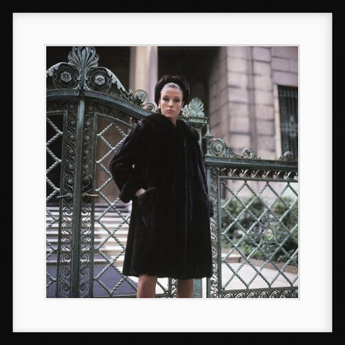 1960s Young Woman Wearing Dark Mink Coat Hat Standing Ornate Wrought Iron Gate Fur Retro by Anonymous