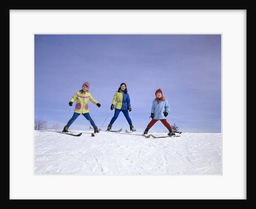mother And Two Daughters Skiing Together Winter Outdoor by Anonymous