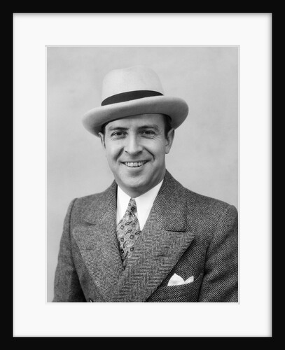 1930s Head & Shoulder Portrait Of Smiling Man In Herringbone Suit Paisley Tie & White Hat by Anonymous