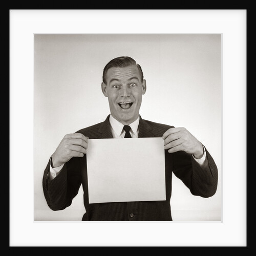 1950s 1960s Excited Businessman Looking At Camera Holding Blank White Card by Anonymous