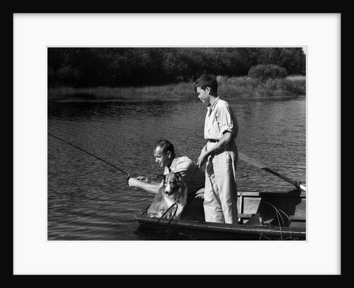 1930s Man Father Teenage Boy Son Dog In Row Boat Fishing In Pond by Anonymous