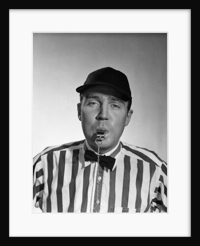 1950s Football Referee Blowing Whistle Looking At Camera by Anonymous