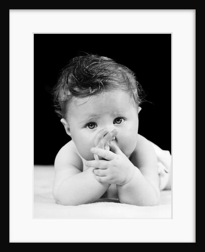 1940s Cute Baby Sucking Thumb Looking At Camera by Anonymous