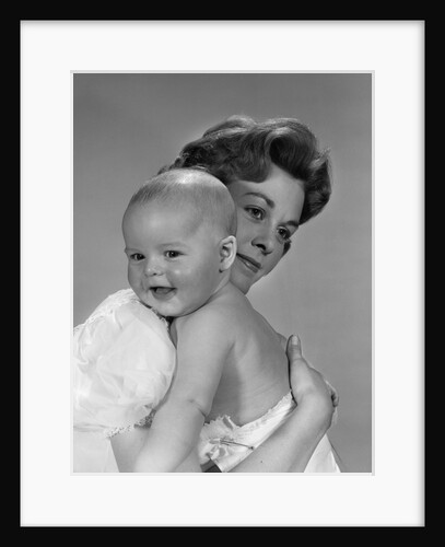 1960s Thoughtful Pensive Mother Holding Happy Baby Child by Anonymous
