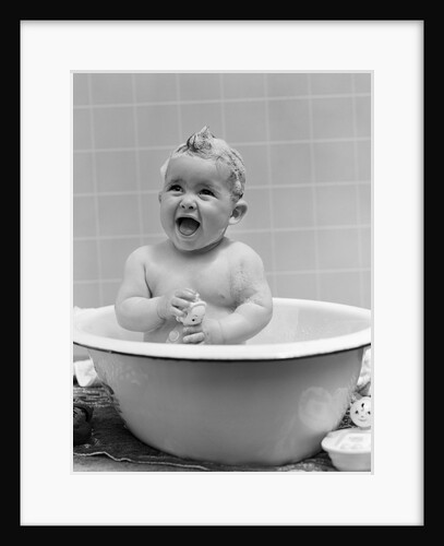 1940s Smiling Baby In Bath Covered In Soap Suds Laughing Holding Toy by Anonymous