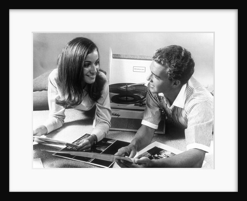 1960s Teen Couple Playing Lp Vinyl Records On Portable Phonograph by Anonymous