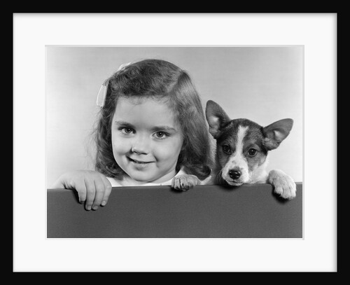 1940s 1950s Portrait Of Little Girl With Small Dog Looking At Camera by Anonymous