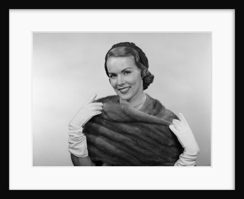 1950s Portrait Glamorous Smiling Woman Wearing Mink Stole White Gloves Pearls And Hat Looking At Camera by Anonymous