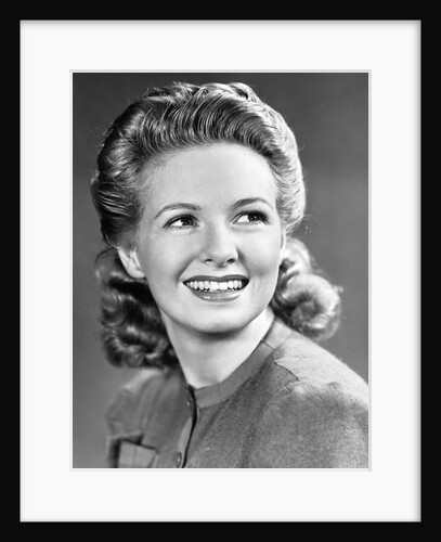 1940s Portrait Of Smiling Woman With Long Blond Curly Hair by Anonymous