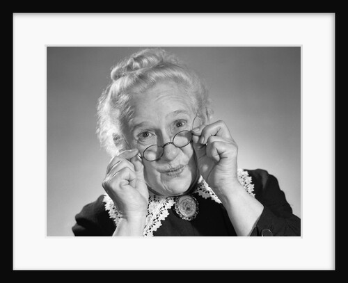 1950s Portrait Of Smiling Old Lady Holding Her Antique Wire Frame Glasses by Anonymous