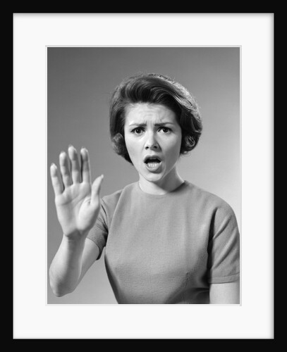 1960s Alarmed Woman Holding Up Her Hand To Stop Something by Anonymous