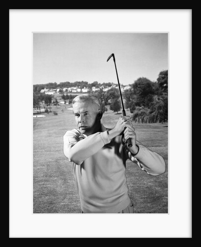 1960s Man Playing Golf Hitting Golf Ball From Fairway With Iron Club by Anonymous