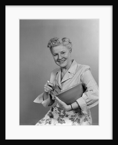 1940s 1950s Smiling Woman Housewife Holding A Mixing Bowl Looking At Camera by Anonymous