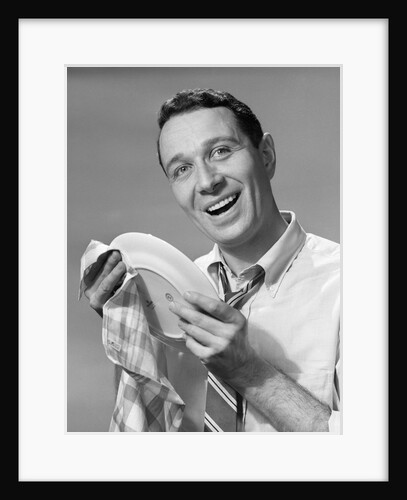 1950s Smiling Man Drying Plate With Dish Towel Looking At Camera by Anonymous
