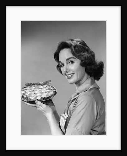 1950s 1960s Smiling Woman Holding Freshly Baked Pie Looking At Camera by Anonymous