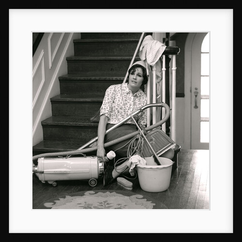 1960s 1970s Exhausted Housewife Sitting At Bottom Of Stairs Surrounded By House Cleaning Equipment by Anonymous