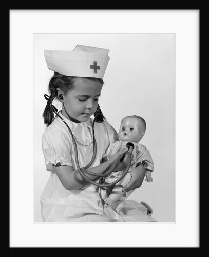 1960s Girl In Nurse Uniform Holding Stethoscope To Baby Doll Chest Indoor by Anonymous