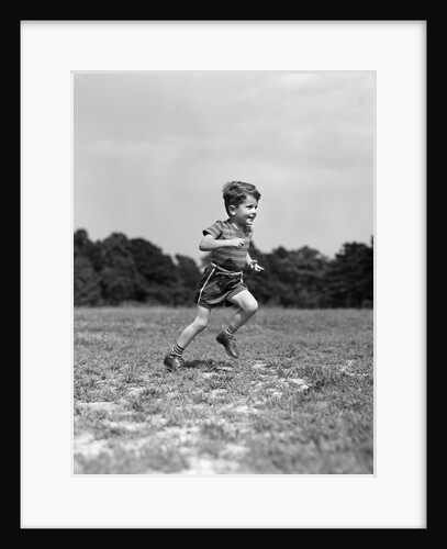 1940s Little Boy Running Playing On Grassy Field by Anonymous