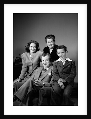 1940s Portrait Family Mother Father Daughter Son Sitting Together On Chair Studio by Anonymous