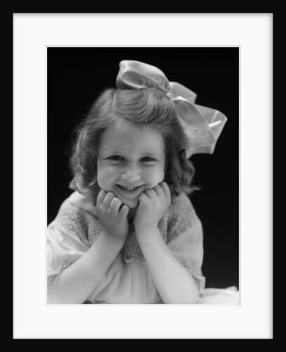 1930s Portrait Smiling Brunette Girl With Big Ribbon Bow In Her Hair Looking At Camera by Anonymous
