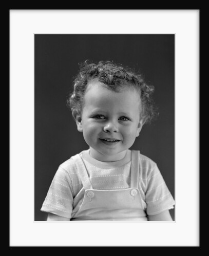 1940s Curly Haired Little Boy Portrait Smiling Looking At Camera by Anonymous