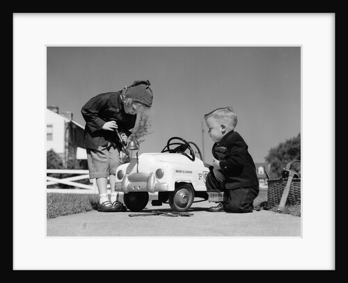 1950s Boy And Girl Playing At Repairing Toy Car by Anonymous