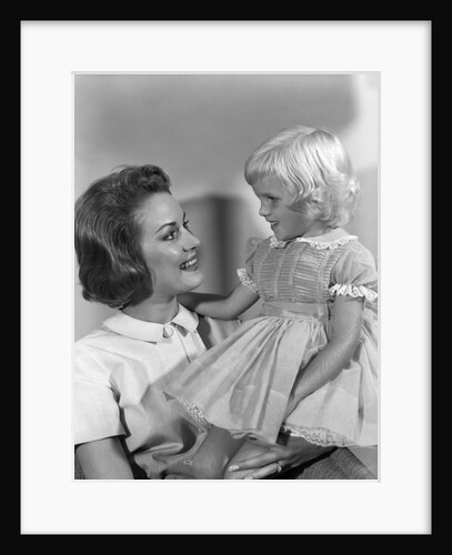 1960s Mother Holding Little Blond Girl Wearing Fancy Dress In Her Arms Looking At Each Other by Anonymous
