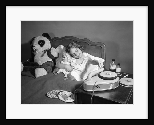 1950s Sick Little Girl In Bed Playing With Record Player by Anonymous