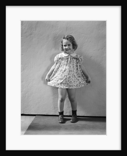 1940s Little Girl Wearing Floral Print Dress Ready To Take A Bow by Anonymous
