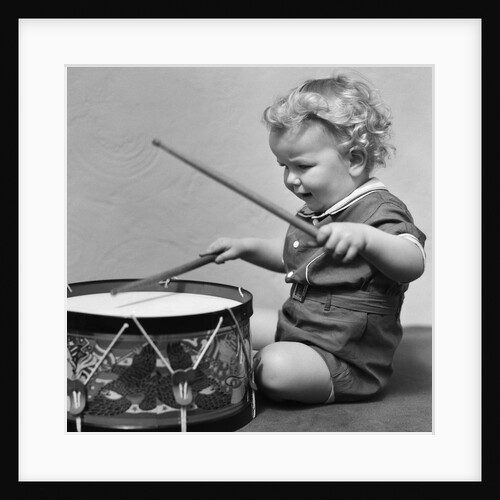 1930s Toddler Boy Playing Toy Drum by Anonymous