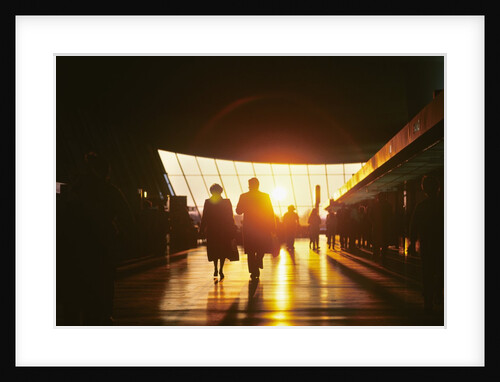 silhouetted Anonymous Passengers Walking Interior Of Airline Terminal At Sunset Dulles International Near Washington Dc Usa by Anonymous