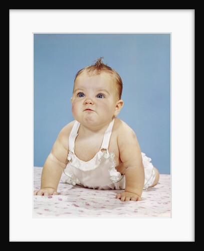1960s Baby Making Funny Face Pushed Up On Arms Crawling Forward by Anonymous